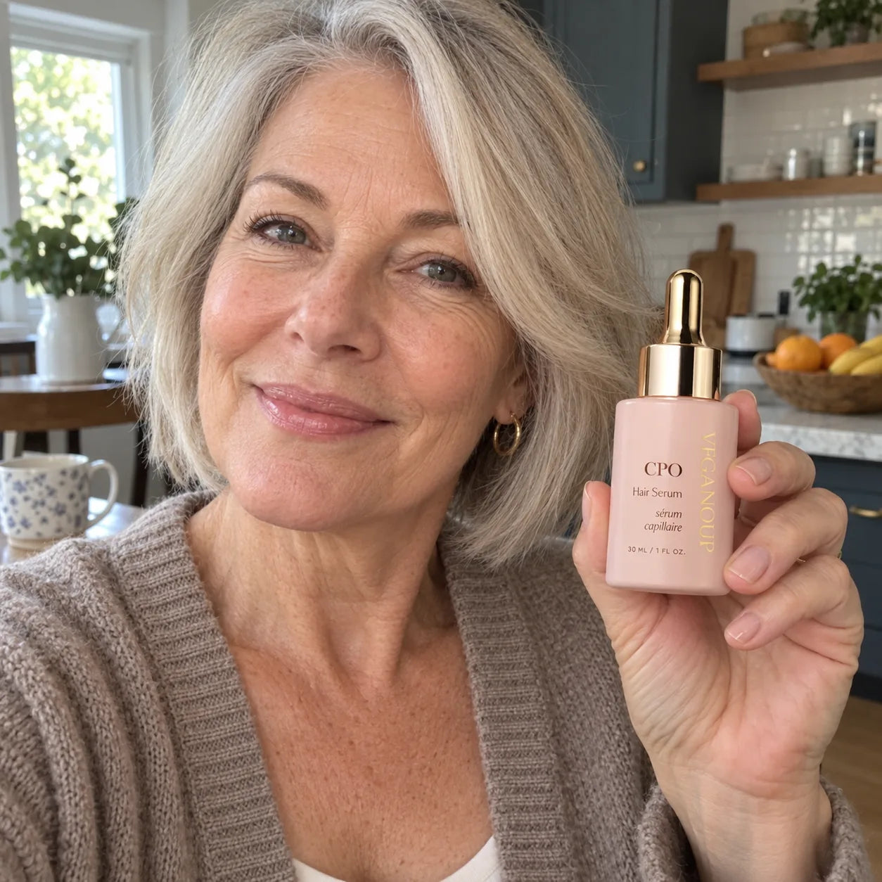 AI model holding CPO Hair Serum in a kitchen